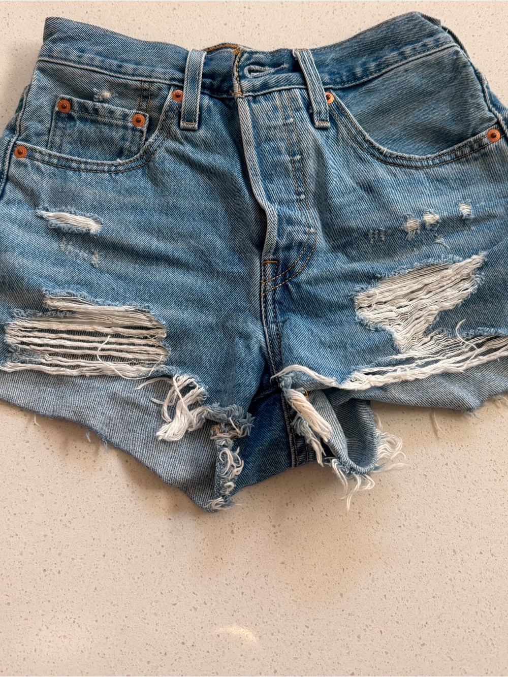 Levi's Distressed Light Blue High-Rise Jean Shorts